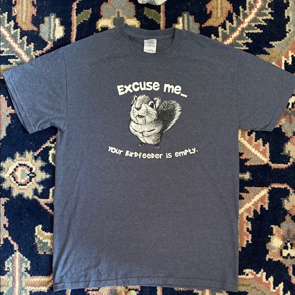 Blue-grey tshirt w/ cute squirrel “Excuse me… your birdfeeder is empty.” Size M.